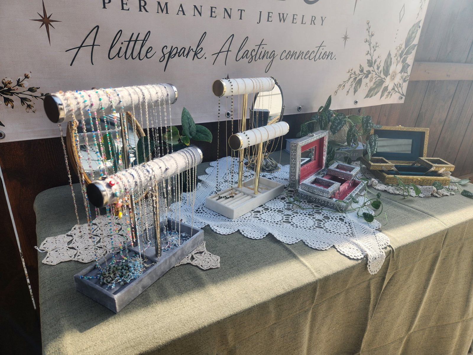 Charmingly Fused jewelry booth with handmade display and jewelry chains